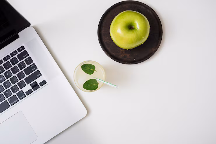 refreshing-drink-with-apples-laptop_23-2148025148